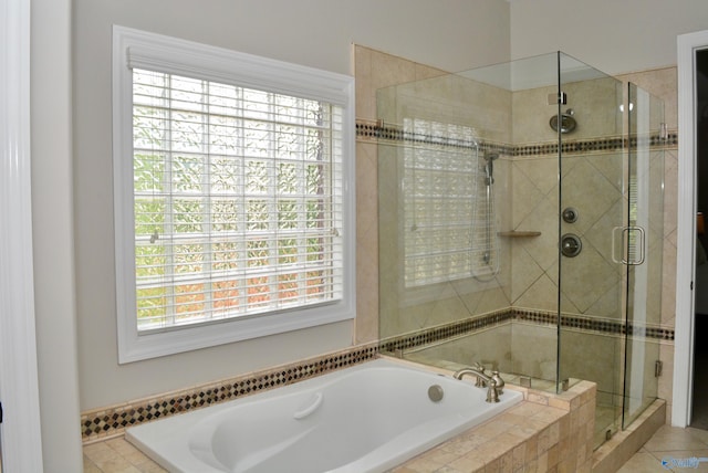 6901 Ridge Pointe Dr SE, Owens Cross Roads, AL 35763 - full bathroom featuring a bath, a stall shower, and tile patterned flooring