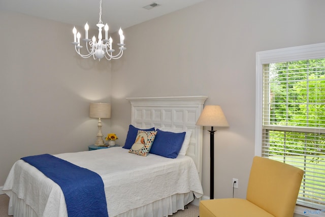 6901 Ridge Pointe Dr SE, Owens Cross Roads, AL 35763 - bedroom featuring a chandelier and carpet flooring