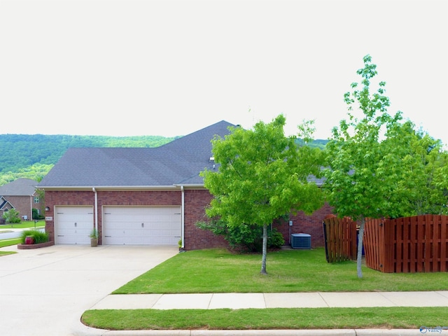 6901 Ridge Pointe Dr SE, Owens Cross Roads, AL 35763 - view of front of house featuring driveway, a garage, and brick siding