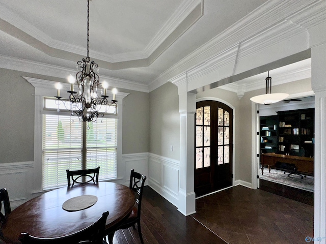 6901 Ridge Pointe Dr SE, Owens Cross Roads, AL 35763 - dining area featuring a chandelier, dark wood-style flooring, arched walkways, wainscoting, and decorative columns