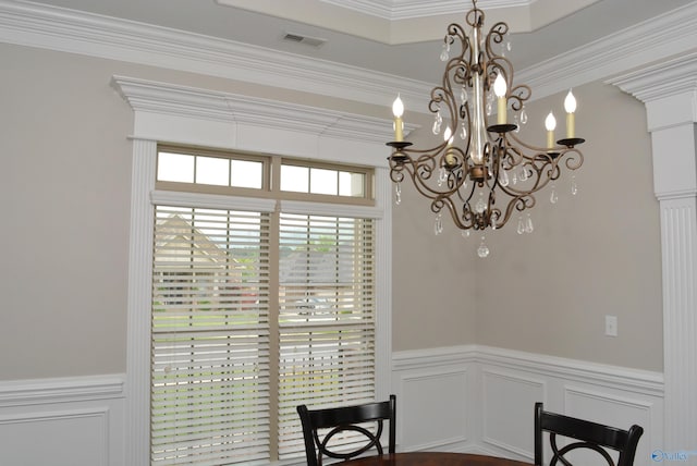 6901 Ridge Pointe Dr SE, Owens Cross Roads, AL 35763 - dining area with a chandelier, a decorative wall, wainscoting, and ornamental molding