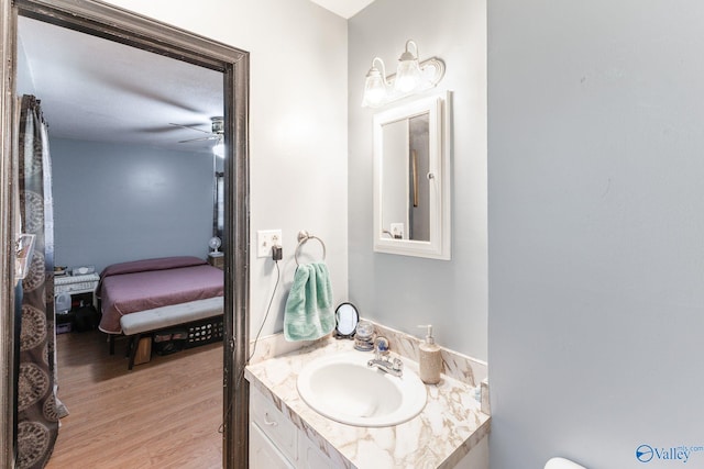 bathroom with vanity, wood-type flooring, and ceiling fan