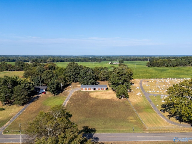 birds eye view of property with a rural view