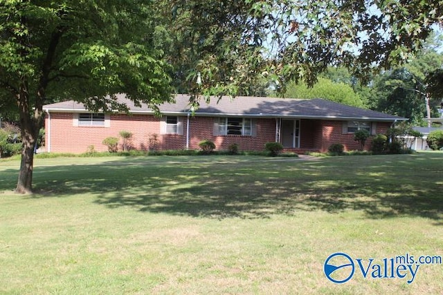 ranch-style home with a front lawn