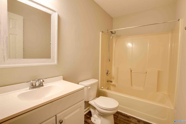 403 Rooks St, Hartselle, AL 35640 - bathroom with toilet, vanity, wood finished floors, and shower / bathing tub combination