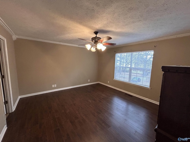 empty room featuring ceiling fan, crown molding, a textured ceiling, and dark wood-type flooring