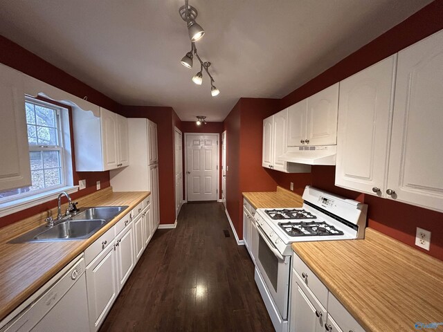 kitchen with white cabinets, white appliances, dark hardwood / wood-style floors, and sink