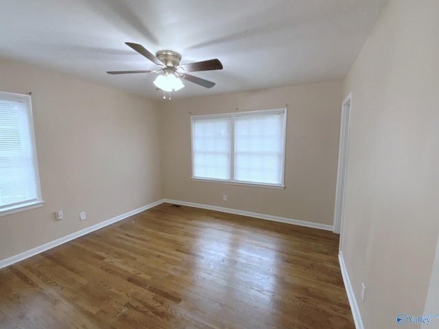 spare room featuring ceiling fan and wood-type flooring