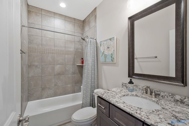 full bathroom with toilet, shower / tub combo with curtain, and vanity