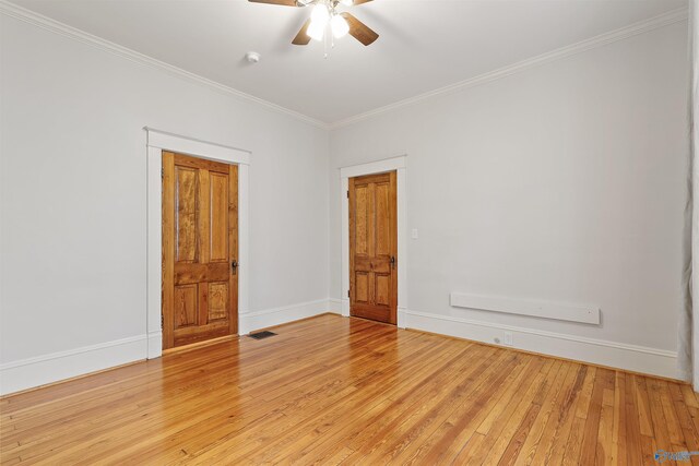 spare room with crown molding, ceiling fan, and light hardwood / wood-style floors