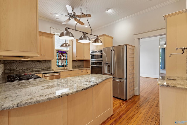 kitchen with light brown cabinets, light wood-type flooring, ceiling fan, stainless steel appliances, and decorative backsplash