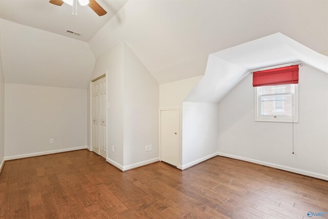 bonus room featuring hardwood / wood-style flooring, lofted ceiling, and ceiling fan