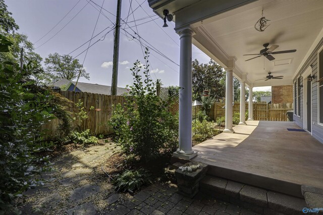 exterior space with ceiling fan