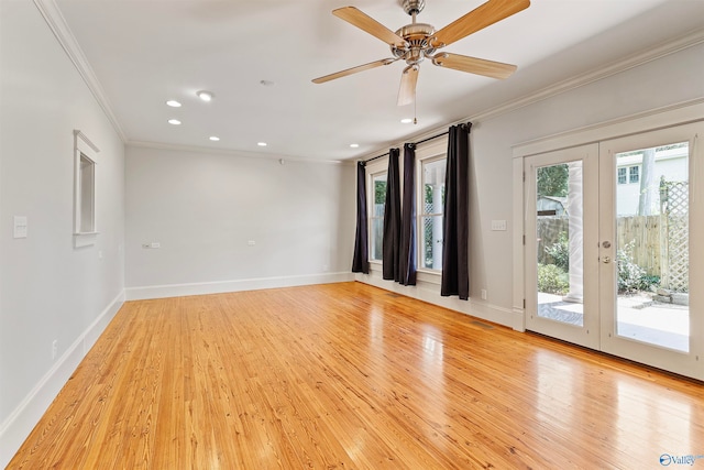 empty room featuring ceiling fan, light wood-type flooring, french doors, and ornamental molding