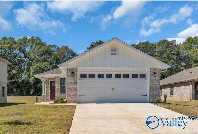 view of front of property featuring a garage and a front lawn