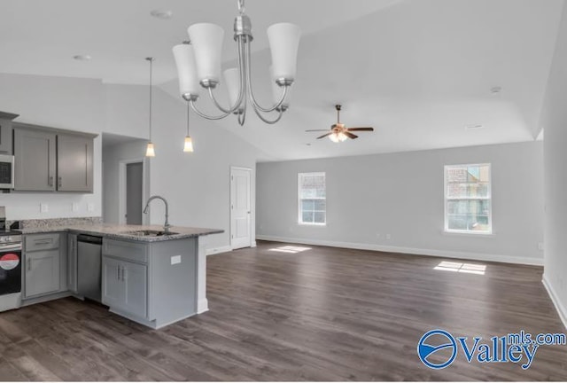 kitchen featuring dark hardwood / wood-style floors, ceiling fan with notable chandelier, and a wealth of natural light