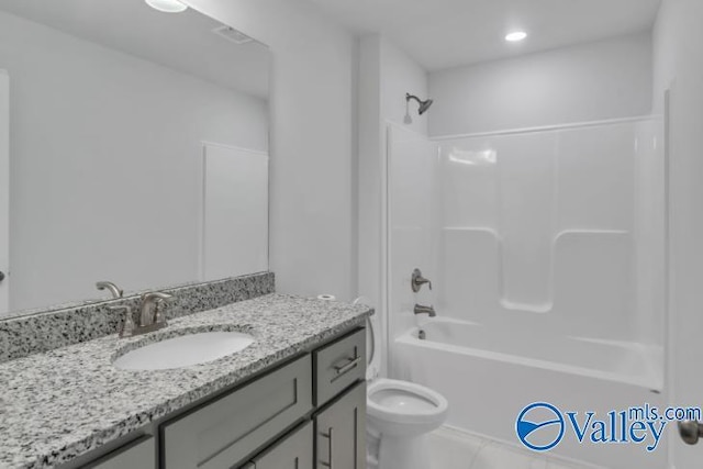 full bathroom featuring toilet, vanity, and bathing tub / shower combination