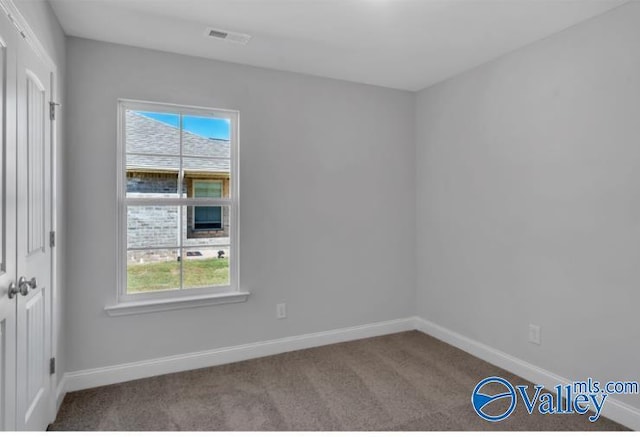 empty room with carpet floors