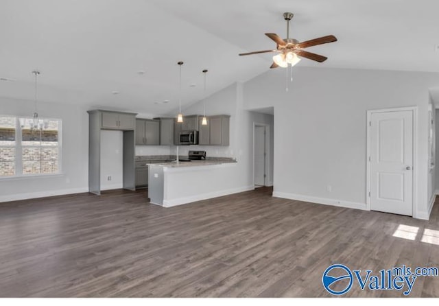 unfurnished living room featuring high vaulted ceiling, ceiling fan, and dark wood-type flooring