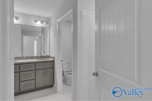 bathroom with vanity and toilet