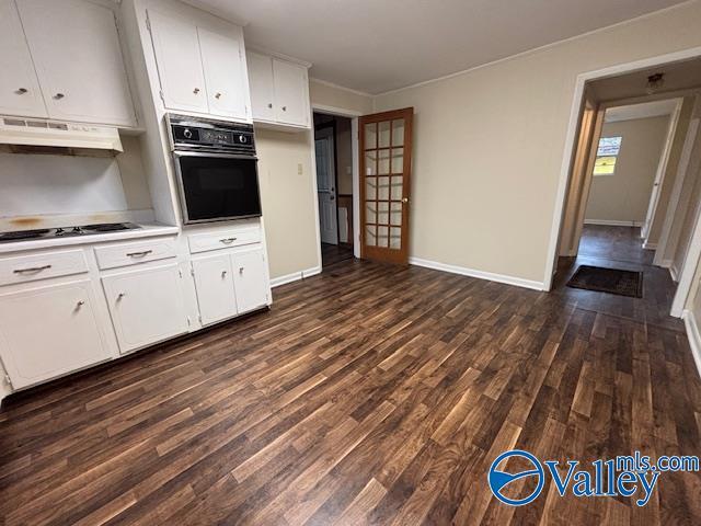 kitchen with black appliances, dark hardwood / wood-style floors, and white cabinets