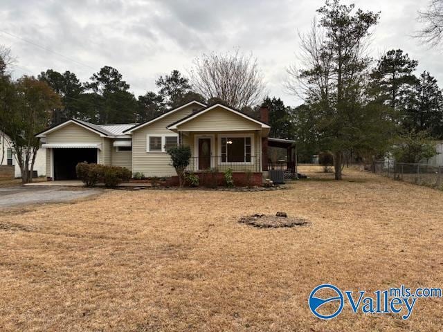 view of front of property featuring a garage and covered porch