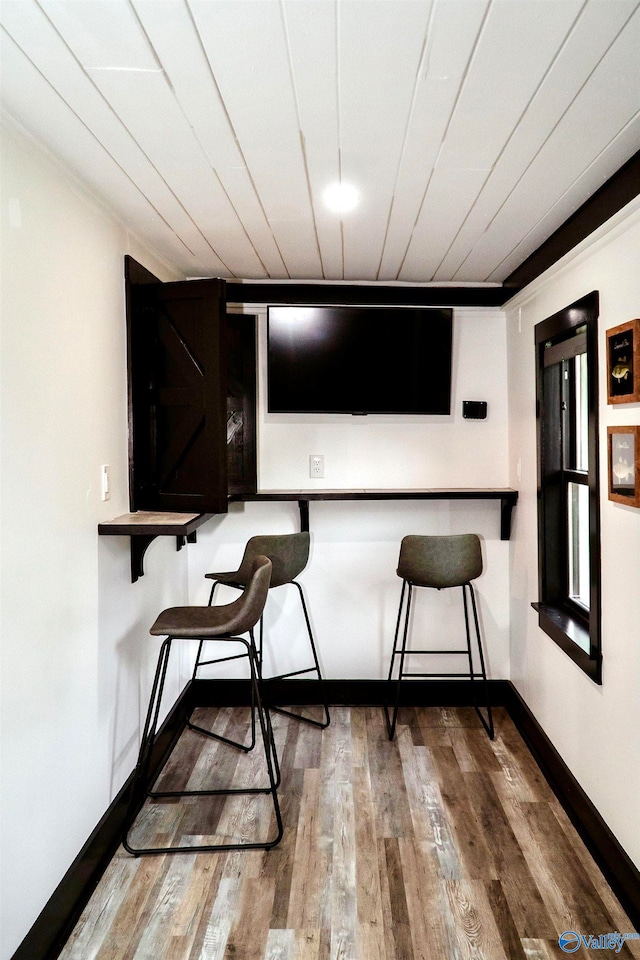 bar featuring hardwood / wood-style flooring