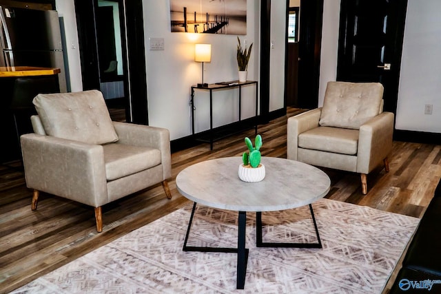 living area featuring hardwood / wood-style floors