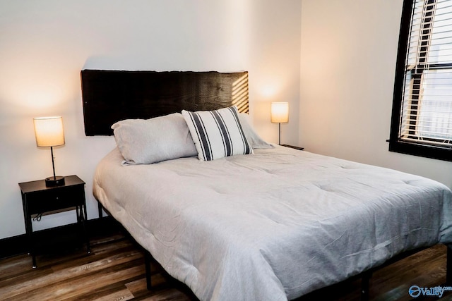 bedroom featuring dark hardwood / wood-style floors