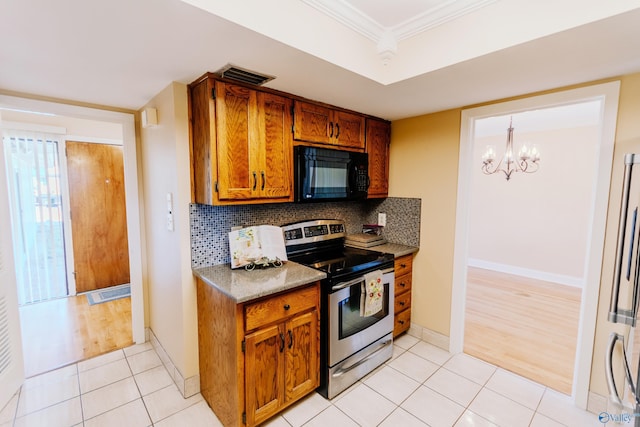 kitchen with light tile patterned floors, visible vents, decorative backsplash, stainless steel electric stove, and black microwave