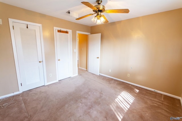 unfurnished bedroom featuring carpet floors, ceiling fan, and baseboards