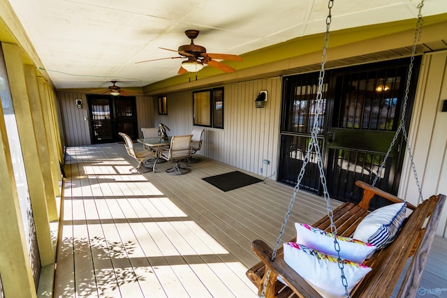 deck with ceiling fan and outdoor dining space