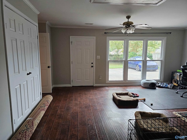 entryway featuring crown molding, wood-type flooring, and ceiling fan