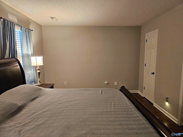 bedroom featuring a textured ceiling