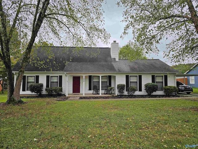 ranch-style home with a front lawn