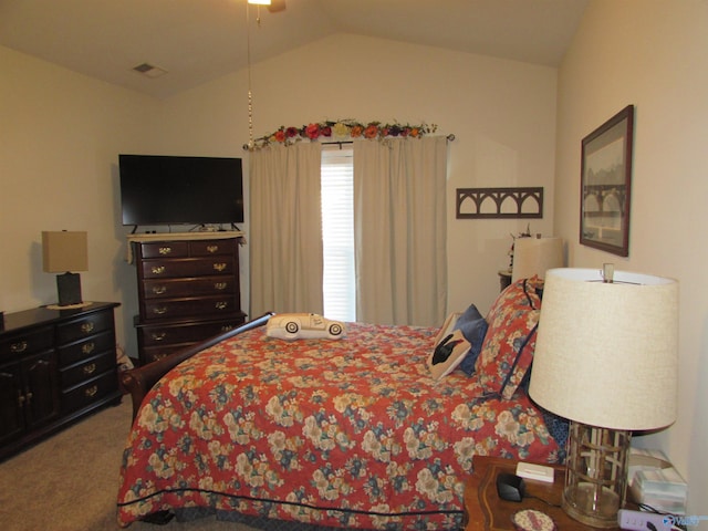 bedroom with carpet and vaulted ceiling