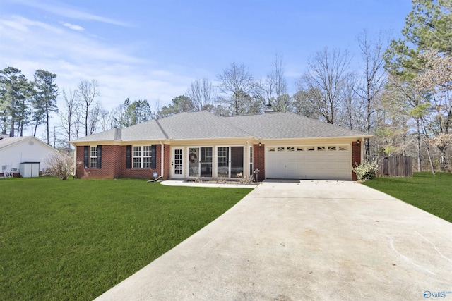 ranch-style house featuring an attached garage, concrete driveway, brick siding, and a front yard