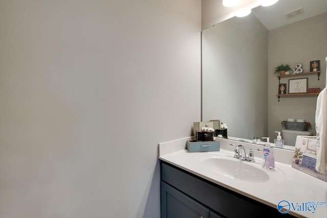 bathroom with visible vents and vanity