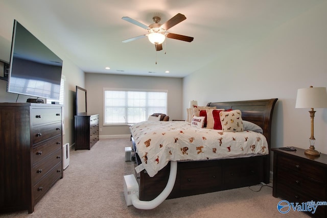 bedroom with recessed lighting, light colored carpet, ceiling fan, and baseboards