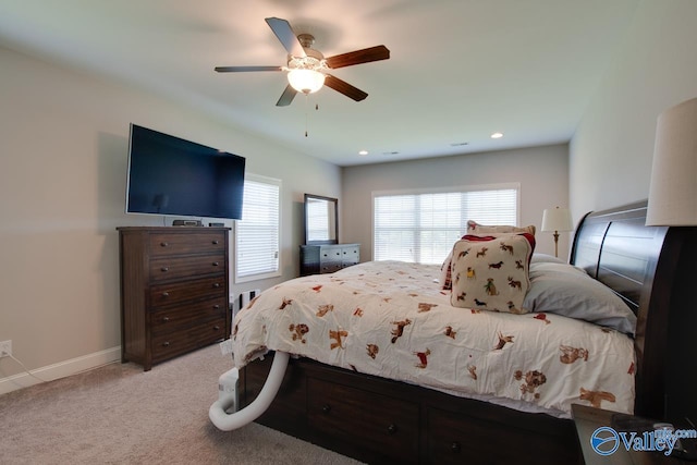 bedroom with a ceiling fan, recessed lighting, light carpet, and baseboards