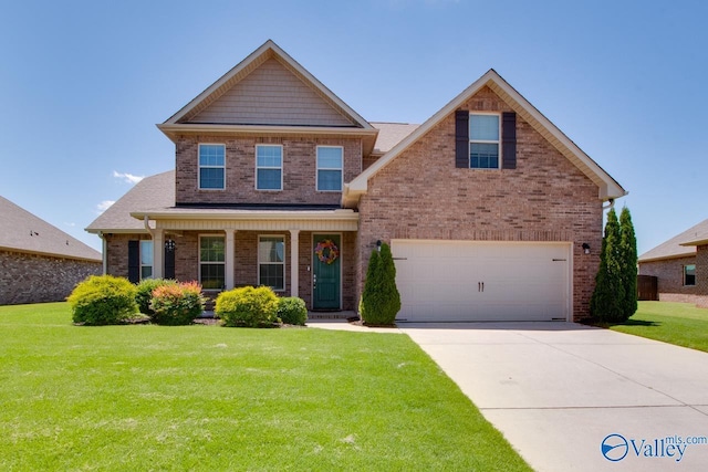 craftsman inspired home featuring driveway, a front lawn, and brick siding