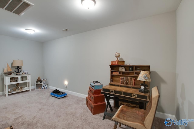 office space featuring baseboards, visible vents, and carpet flooring