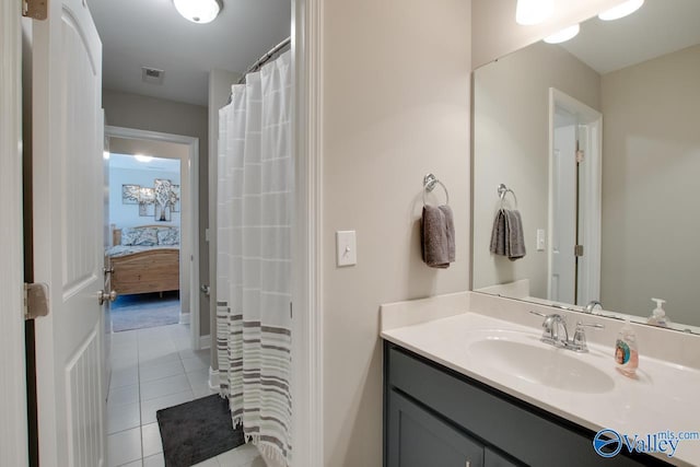 full bathroom with tile patterned flooring, visible vents, and vanity