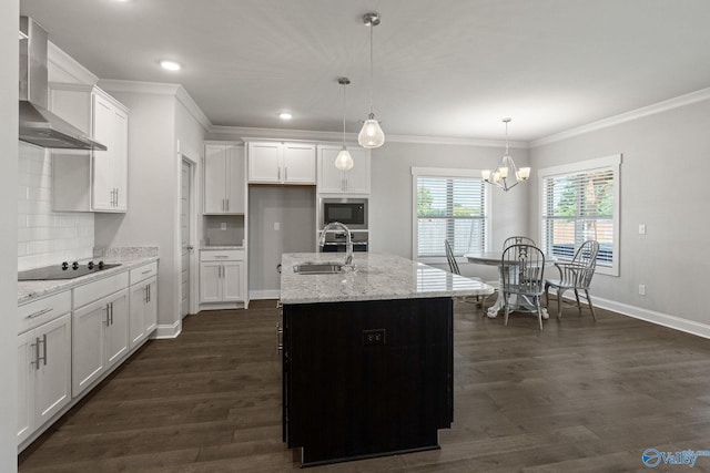 kitchen with backsplash, decorative light fixtures, appliances with stainless steel finishes, wall chimney exhaust hood, and dark hardwood / wood-style floors