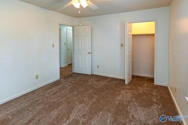 unfurnished bedroom with dark carpet, a closet, and ceiling fan