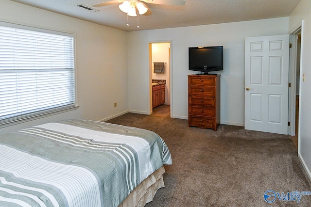 bedroom with ceiling fan and dark colored carpet