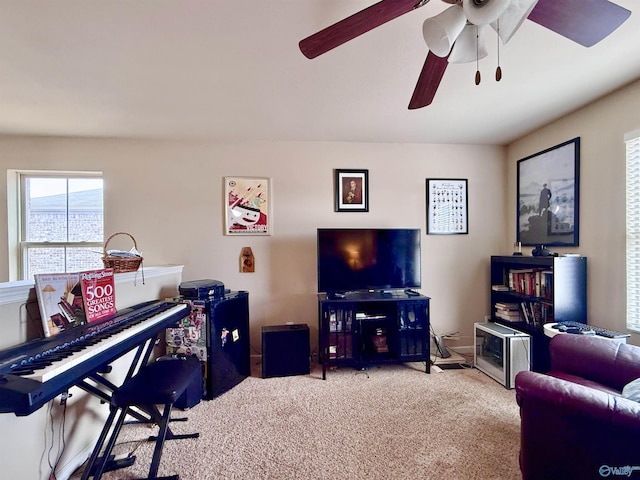 living room with light colored carpet and ceiling fan