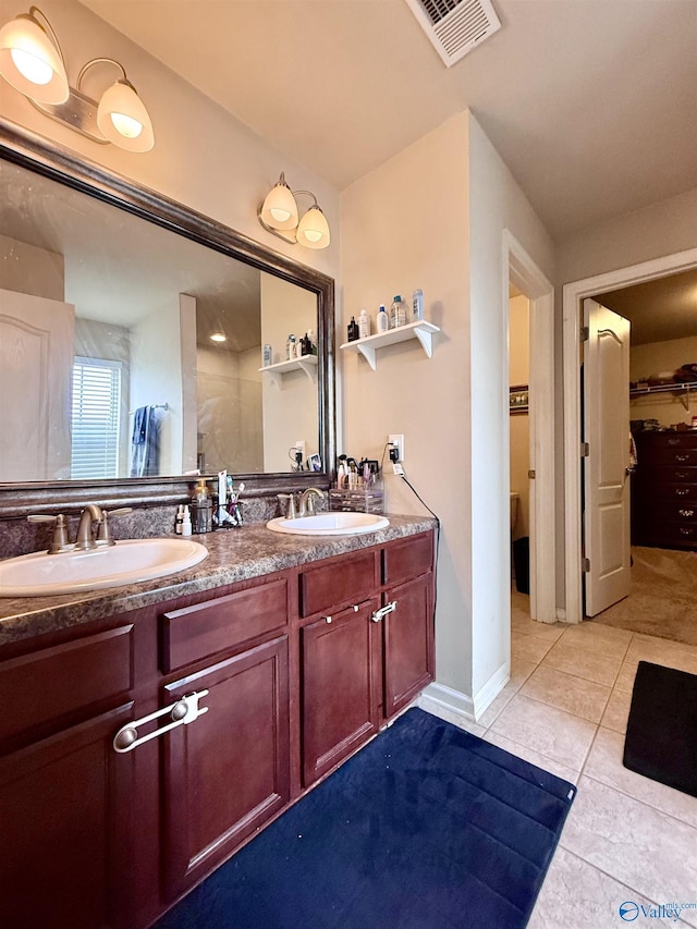 bathroom featuring tile patterned floors and vanity