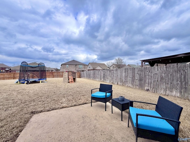 exterior space featuring a trampoline and a playground