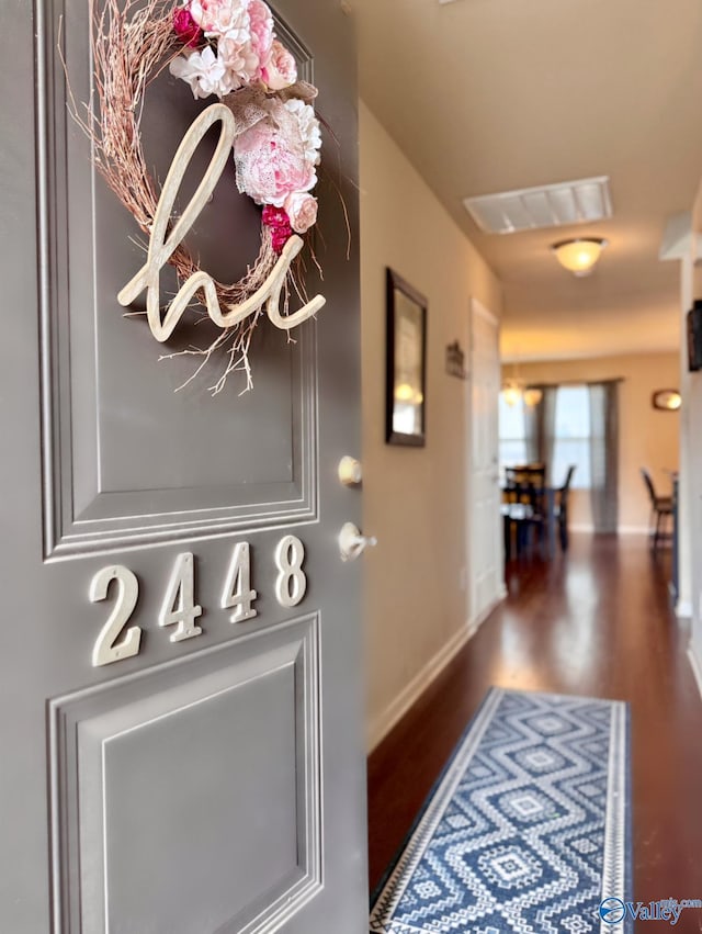 entryway with dark hardwood / wood-style floors